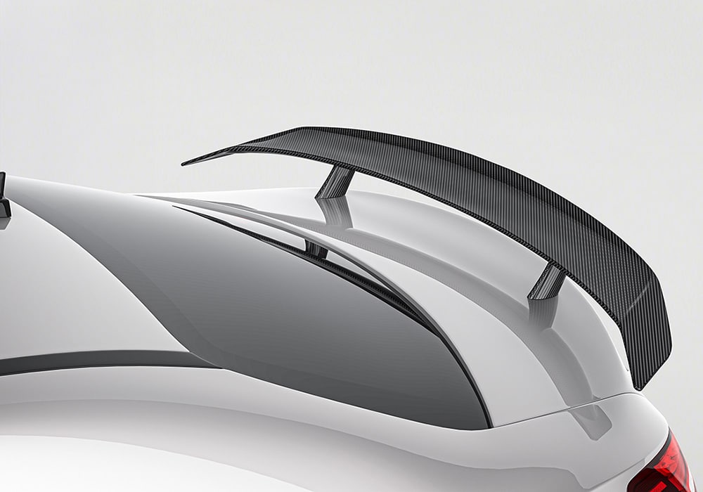 A side-by-side comparison of the CLA-Class before and after installation of the full carbon fiber kit, highlighting the transformation in both appearance and profile