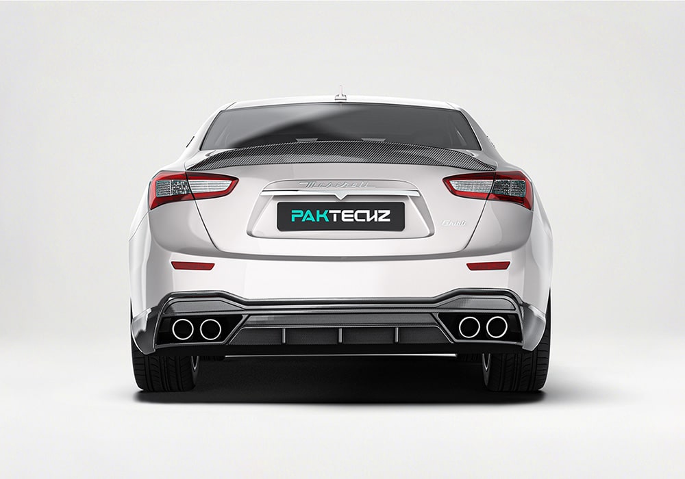 Maserati Ghibli zooms around a racetrack, showcasing the downforce and stability enabled by the aerodynamic upgrades