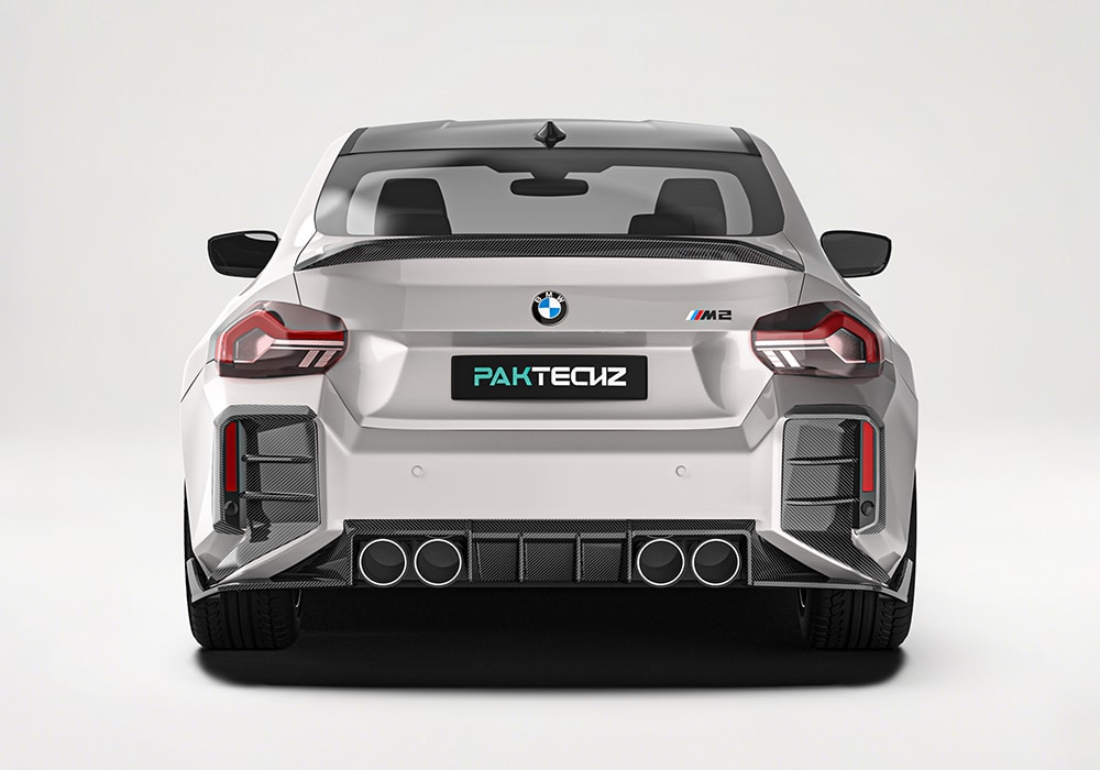 Dynamic close-up of the Carbon Fiber Front Splitters, illustrating improved downforce and bold, race-inspired styling during high-speed drives