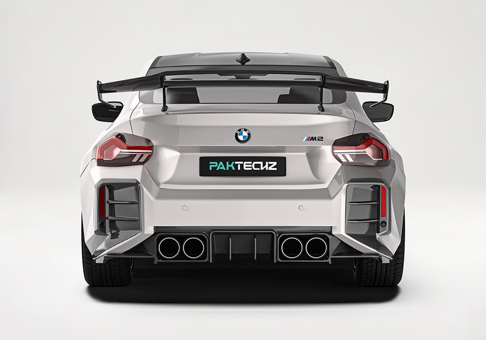 Dynamic close-up of the Carbon Fiber Front Splitters, illustrating improved downforce and bold, race-inspired styling during high-speed drives
