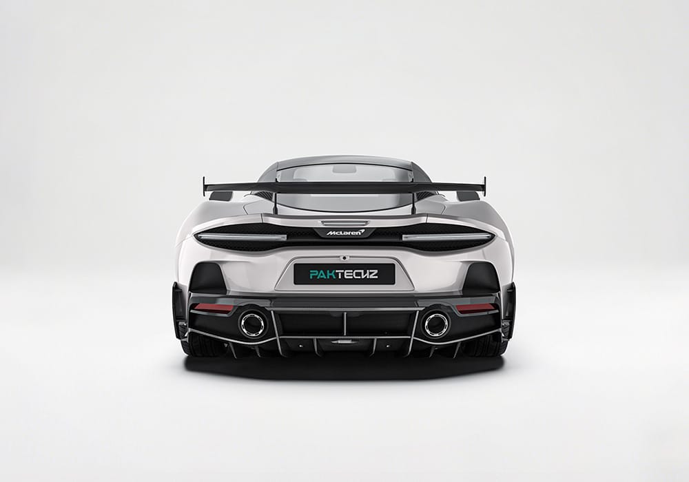 A moving shot of the McLaren GT on a race track, showcasing reduced drag and optimized airflow through the carbon fiber aerodynamic upgrades