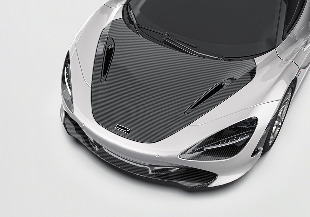McLaren 720S equipped with Carbon Fiber Rear Wing on a racetrack, showcasing improved downforce capabilities