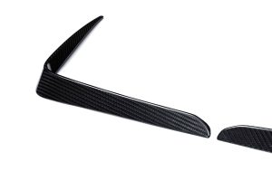 A side-by-side comparison highlighting the design upgrade of the BMW XM G09 with and without the Carbon Fiber Rear Canards, emphasizing their styling impact