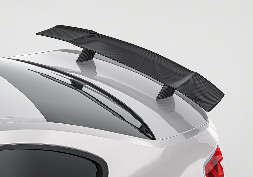 Split-image comparison of the stock BMW M2 F87 versus the fully-upgraded model with the Carbon Fiber Aerodynamics Body Kit, showcasing styling improvements