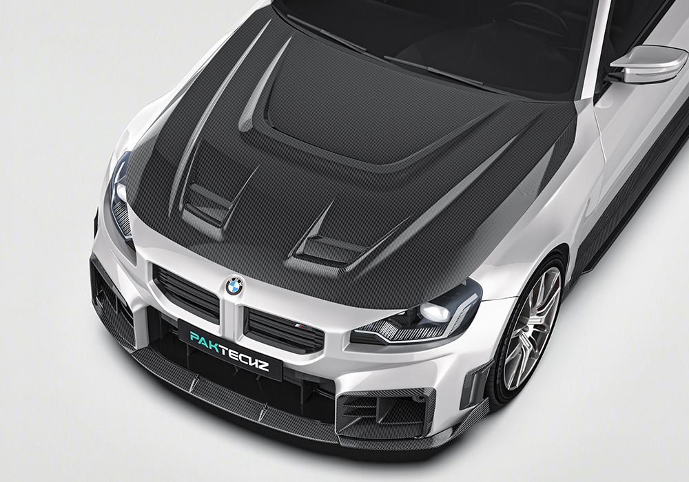 Split-panel showing the factory BMW M2 G87 versus the upgraded, aggressive appearance with the Carbon Fiber Aerodynamic Body Kit installed