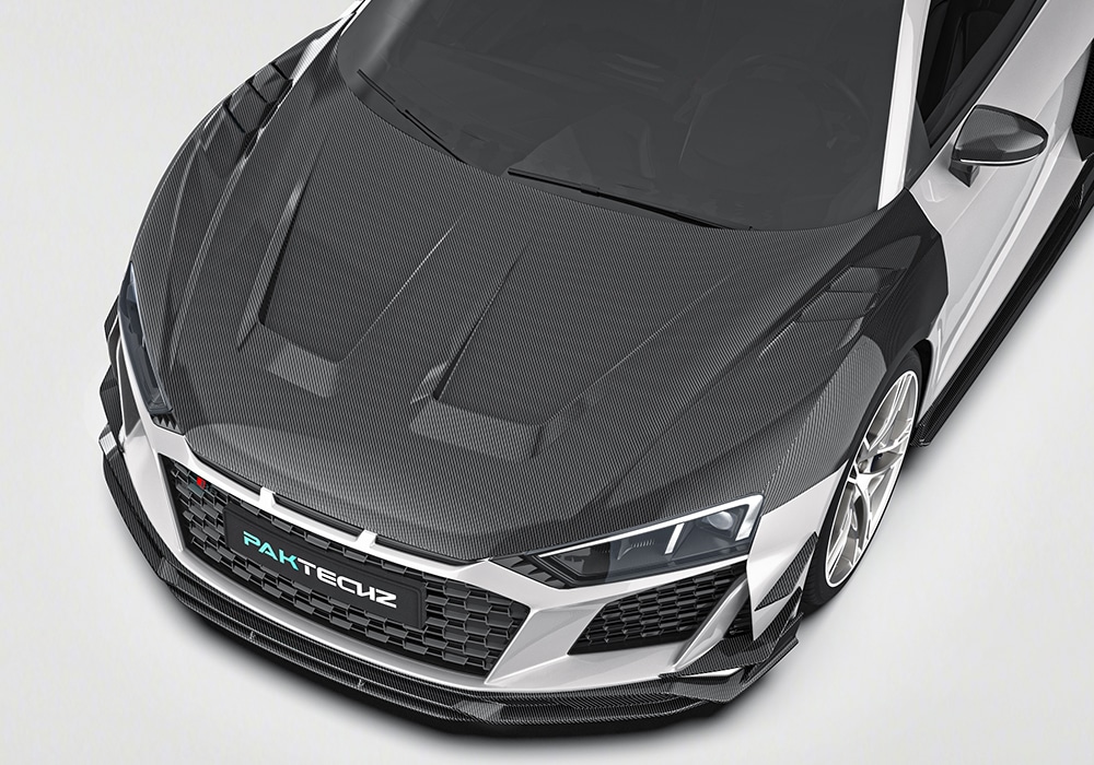 Audi R8 equipped with an aerodynamic body kit demonstrating cornering precision and stability at high speed on a winding track