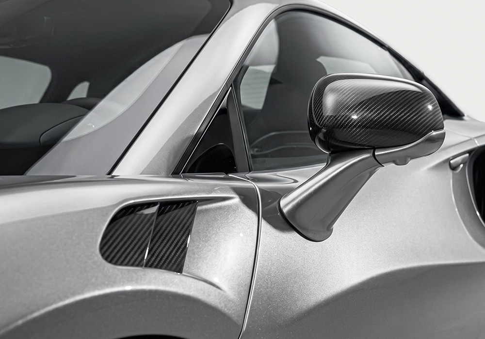 McLaren Artura Carbon Fiber Aero Kit components displayed, showcasing their lightweight construction
