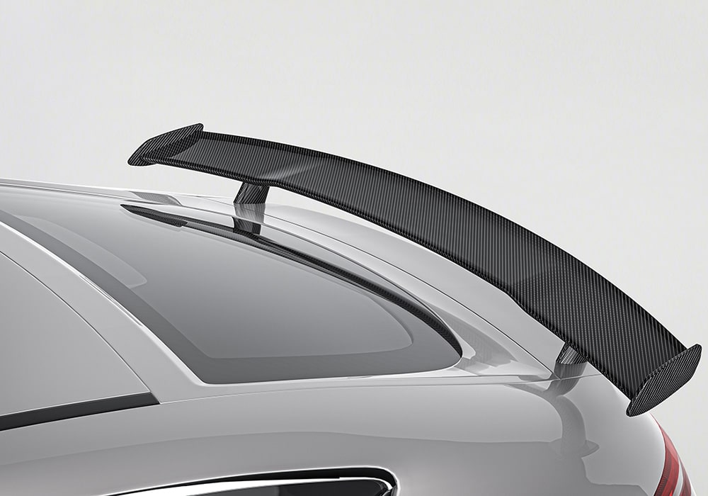 Step-by-step instructional visuals explaining how the components of the Carbon Fiber Aerodynamics Kit (spoiler, skirts, diffuser) can be seamlessly installed with OEM-grade precision