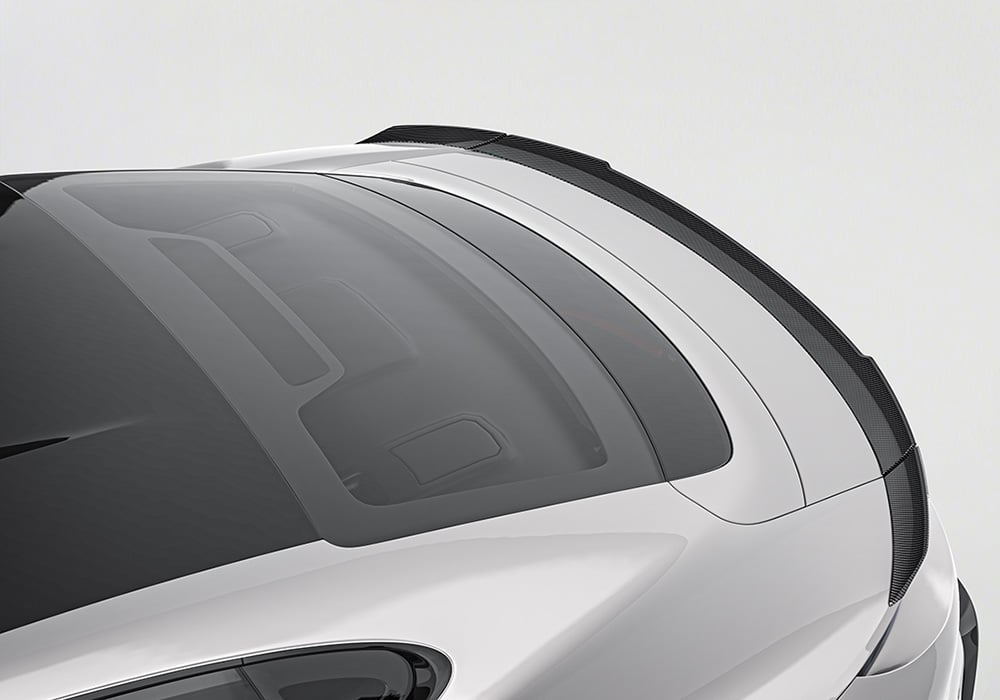 Side-by-side visual comparison of the Taycan pre-upgrade (stock body styling) versus its bold, aerodynamic look after installing the Carbon Fiber Aero Kit