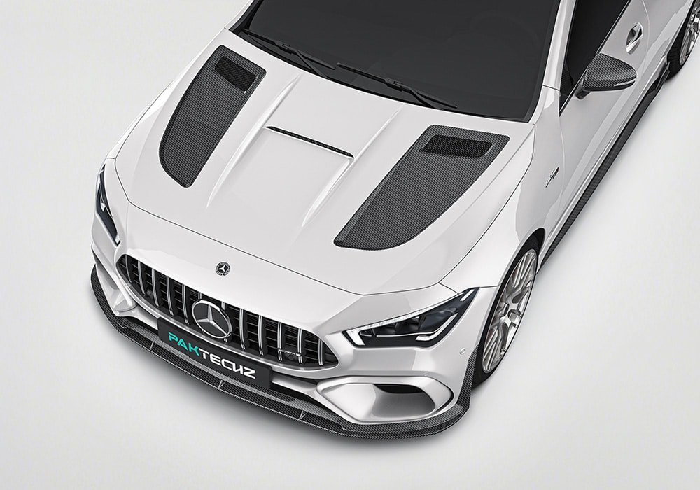 A side profile image of the Mercedes Benz CLA-Class W118 showcasing all components: carbon fiber side skirts, rear spoiler, rear diffuser, and front splitter, with sleek and aggressive contours