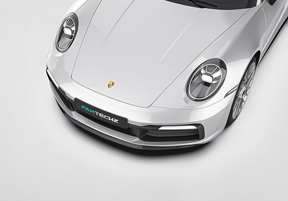A stunning full-body image showcasing the Porsche 911 992.1 fitted with the complete Carbon Fiber Aero Kit, emphasizing the aggressive styling and race-ready appeal.