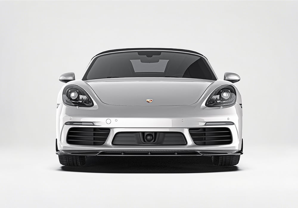Display the complete look of the Porsche 718 with the Carbon Fiber Front Splitter, Side Skirts, and Rear Diffuser installed, showcasing bold styling