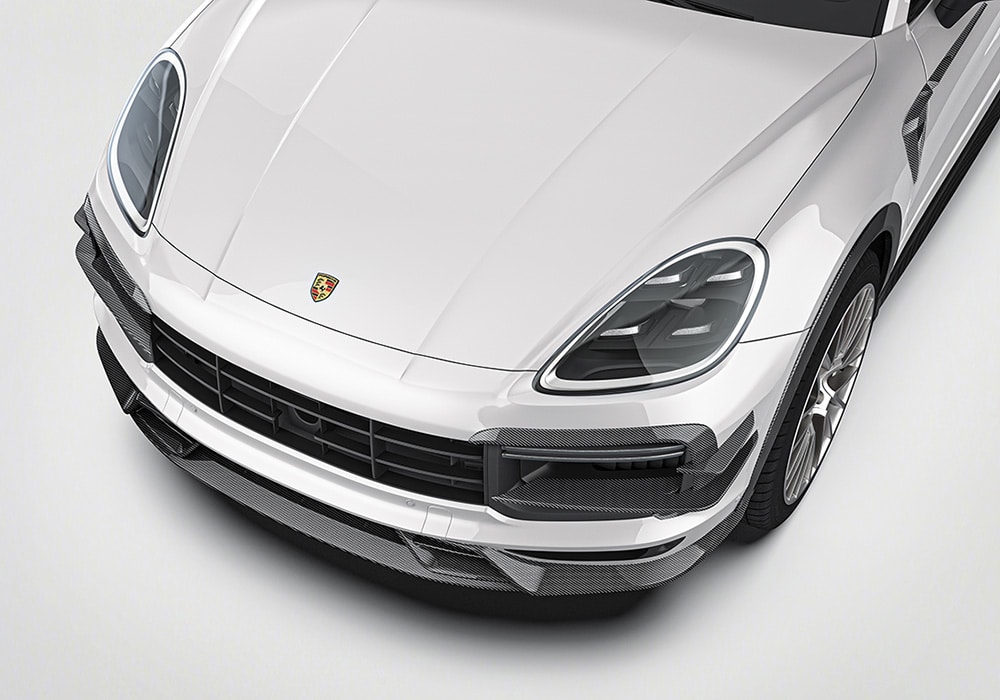 A complete exterior view of a Cayenne featuring the Carbon Fiber Aero Kit, showcasing its aggressive yet luxurious transformation
