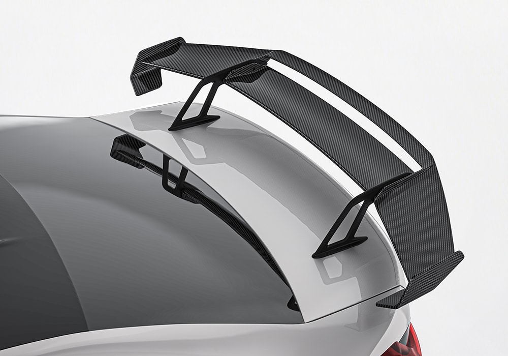 A complete view of the BMW M3 G80 showcasing the installed Carbon Fiber Aero Kit with the front splitter, side skirts, rear diffuser, and trunk spoiler