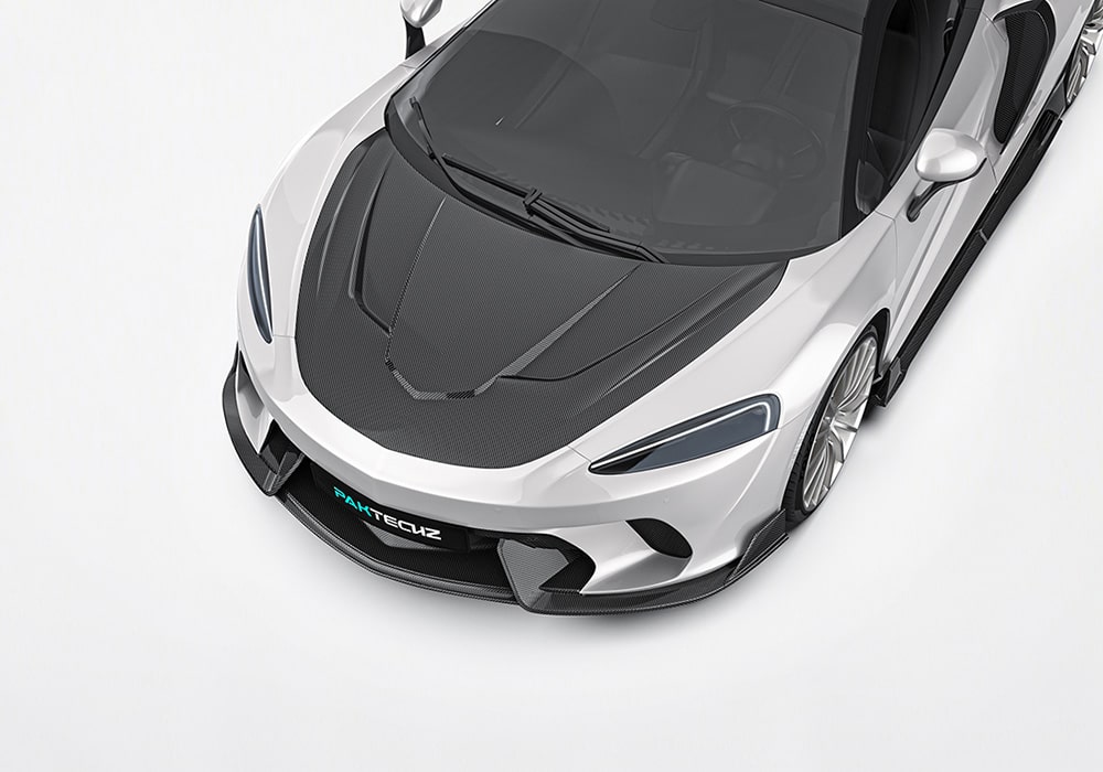 Showcasing the aggressive styling and aerodynamic boost provided by the precision-engineered carbon fiber front splitter on the McLaren GT