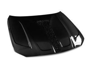 Racing shot of the BMW M3 G80 with Carbon Fiber Hood, showcasing improved handling and aerodynamics on high-speed runs