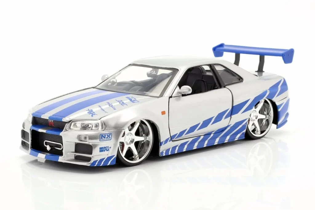 车型 1:24 Nissan Skyline GT-R (R34) Brian O’Conner Film 2 Fast 2 Furious ( ) 年 2003 银色 / 蓝色 Jadatoys
