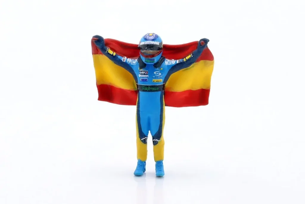 ฟิกเกอร์ 1:43 Fernando Alonso พร้อม Flagge น้ำเงิน, เหลือง Fernando Alonso สีน้ำเงินเหลือง Cartrix