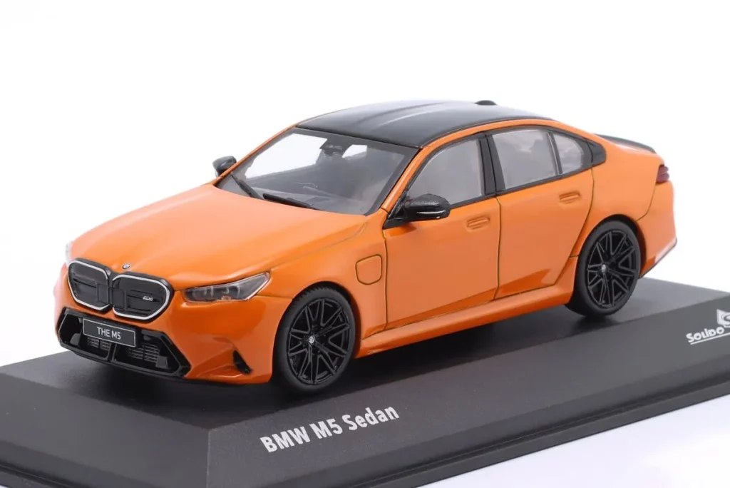 Model 1:43 BMW M5 Sedan year 2024 orange Solido