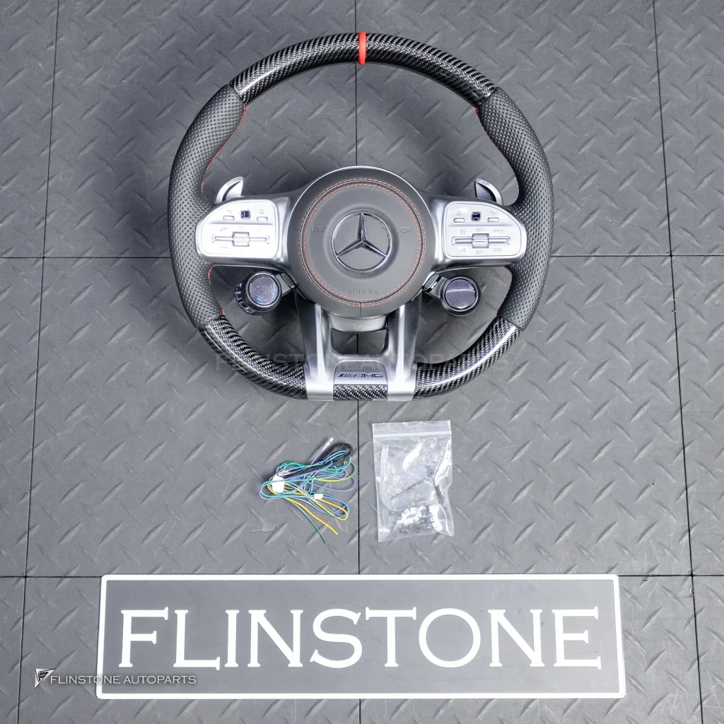ต้องขัดคราบกาวออกก่อน พวงมาลัย Carbon fiber หนังดำ ด้ายแดง กรอบเงิน พร้อม Drive Unit สำหรับ W205 C-Class