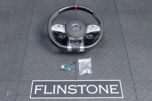 ต้องขัดคราบกาวออกก่อน พวงมาลัย Carbon fiber หนังดำ ด้ายแดง กรอบเงิน พร้อม Drive Unit สำหรับ W205 C-Class
