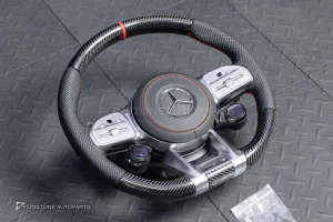 ต้องขัดคราบกาวออกก่อน พวงมาลัย Carbon fiber หนังดำ ด้ายแดง กรอบเงิน พร้อม Drive Unit สำหรับ W205 C-Class