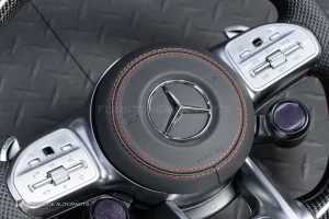 ต้องขัดคราบกาวออกก่อน พวงมาลัย Carbon fiber หนังดำ ด้ายแดง กรอบเงิน พร้อม Drive Unit สำหรับ W205 C-Class