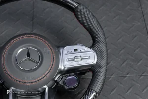 ต้องขัดคราบกาวออกก่อน พวงมาลัย Carbon fiber หนังดำ ด้ายแดง กรอบเงิน พร้อม Drive Unit สำหรับ W205 C-Class