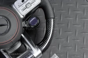 ต้องขัดคราบกาวออกก่อน พวงมาลัย Carbon fiber หนังดำ ด้ายแดง กรอบเงิน พร้อม Drive Unit สำหรับ W205 C-Class