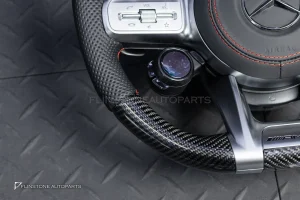 ต้องขัดคราบกาวออกก่อน พวงมาลัย Carbon fiber หนังดำ ด้ายแดง กรอบเงิน พร้อม Drive Unit สำหรับ W205 C-Class
